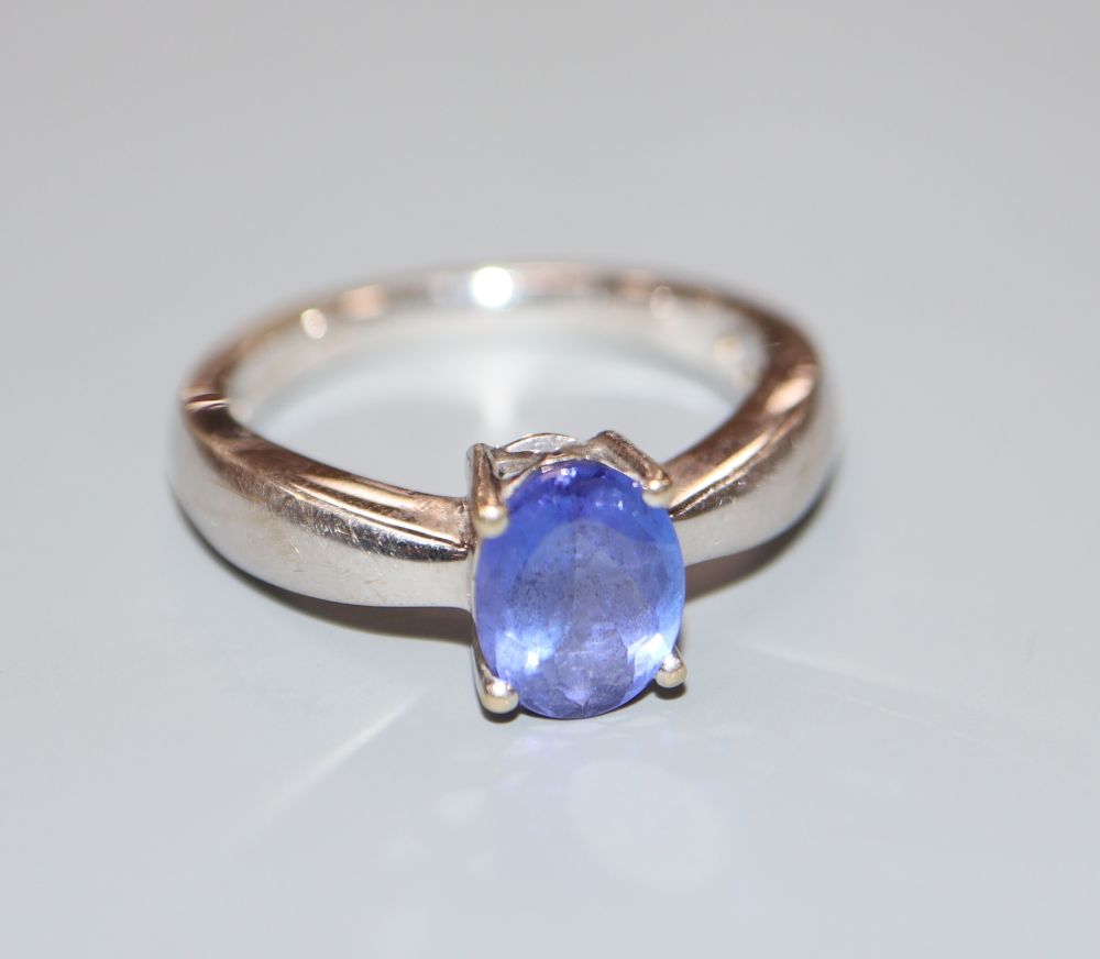 A modern Illana 18ct white gold and oval tanzanite ring, size O.